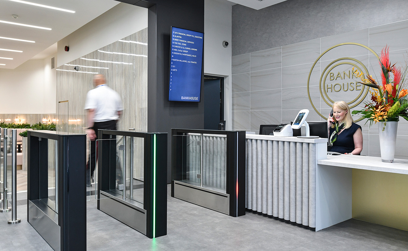 Manned reception and pass card security gates for the refurbished offices at Bank House.