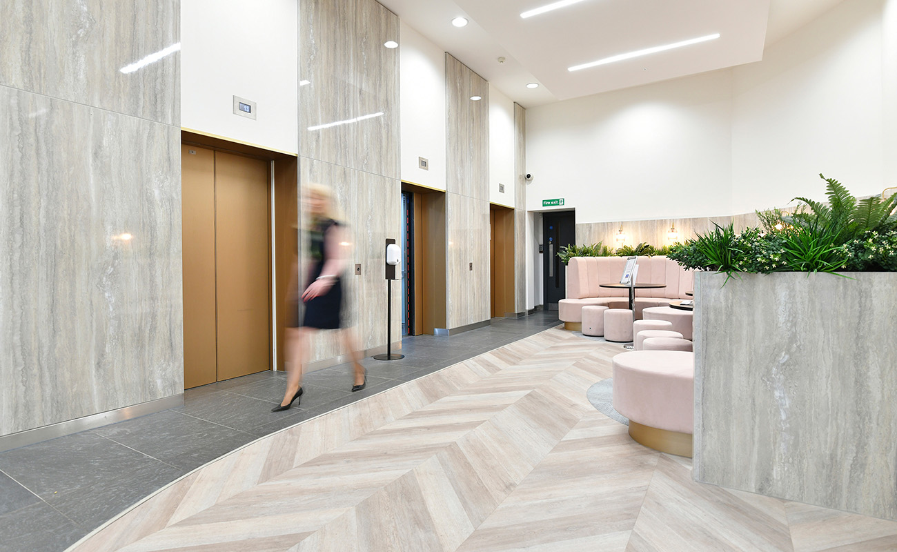 Elevators and seating area inside the reception of Bank House.